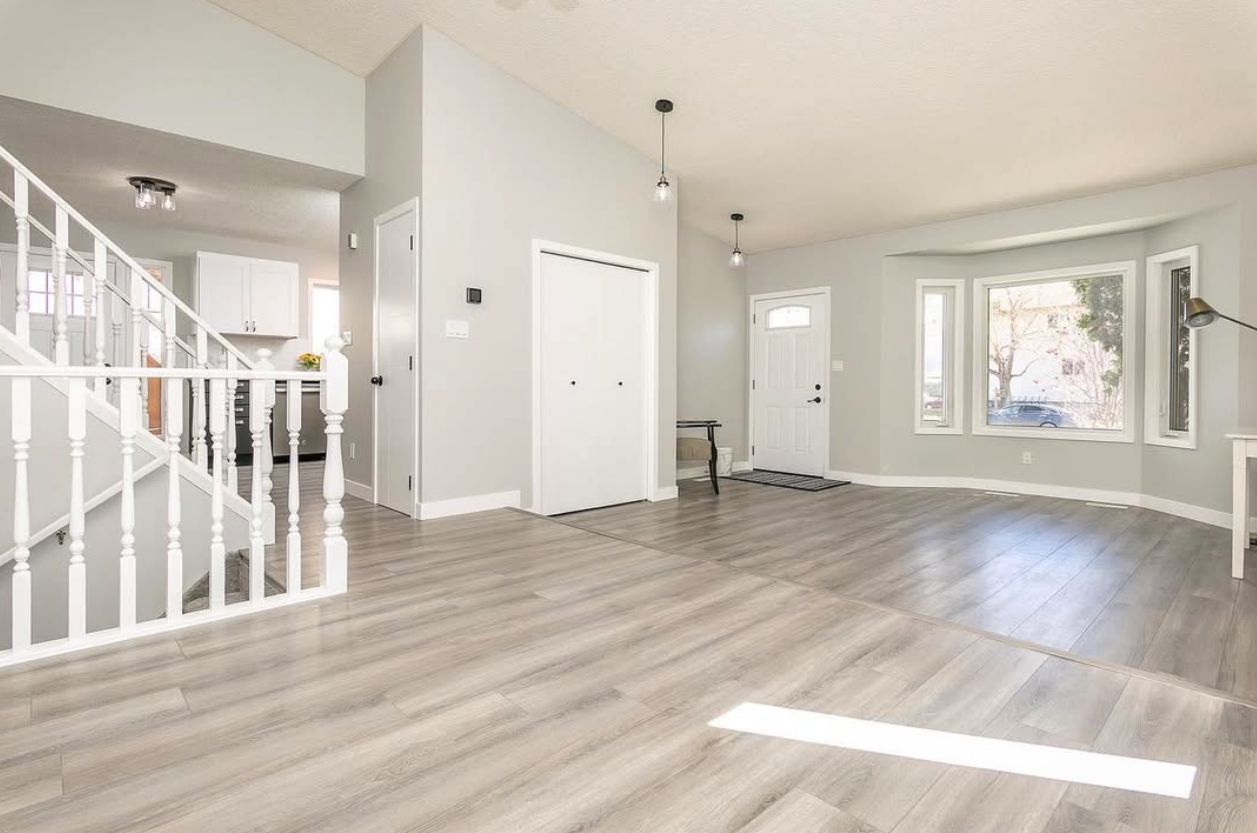 Freshly painted interior with grey walls and white trim