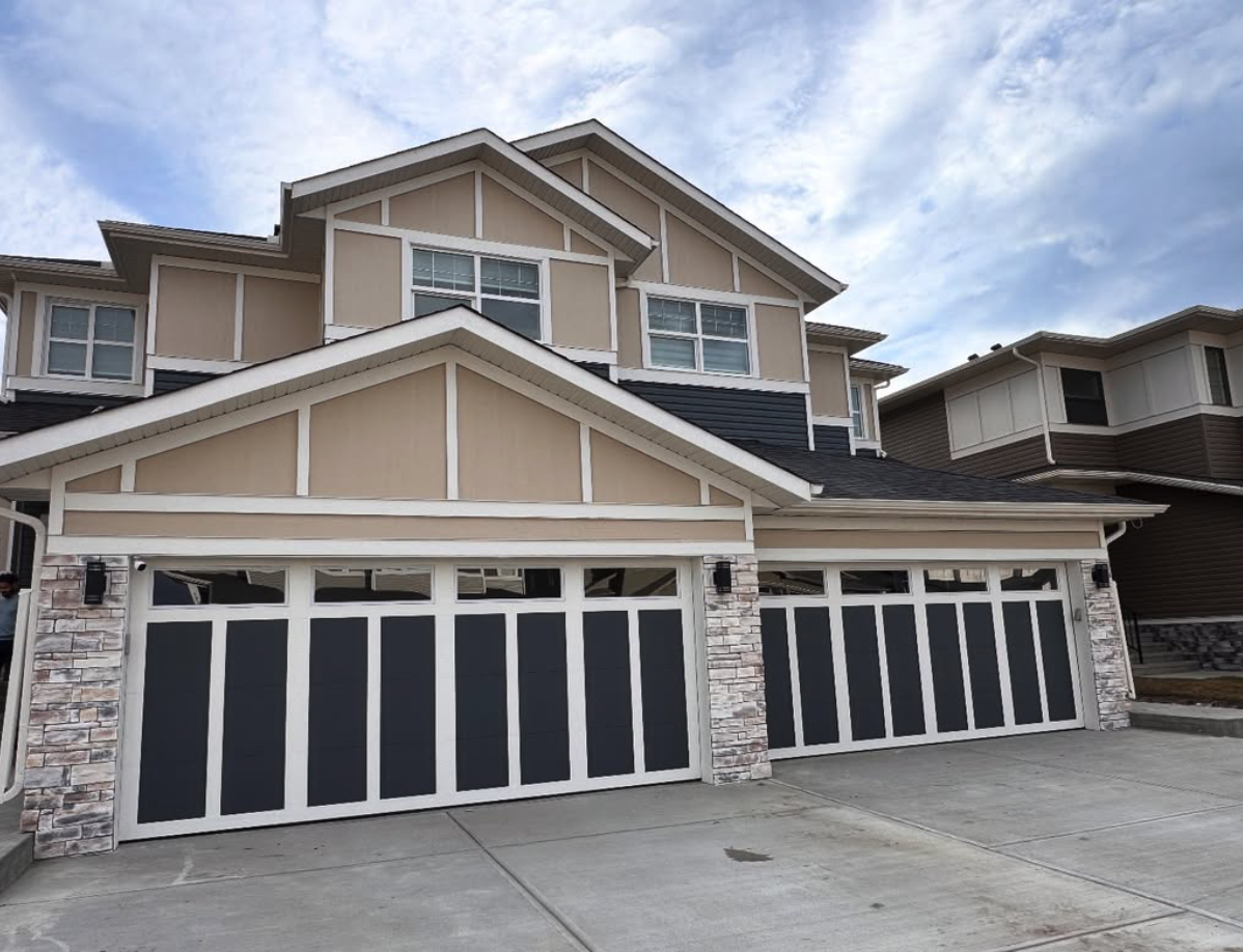 Freshly painted garage doors and trim on a Calgary home